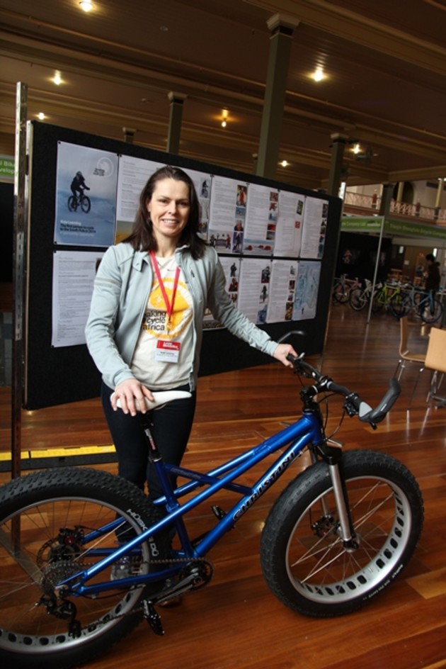 Kate displays her custom built Christini two wheel drive bicycle that she hopes will carry her to the South Pole.